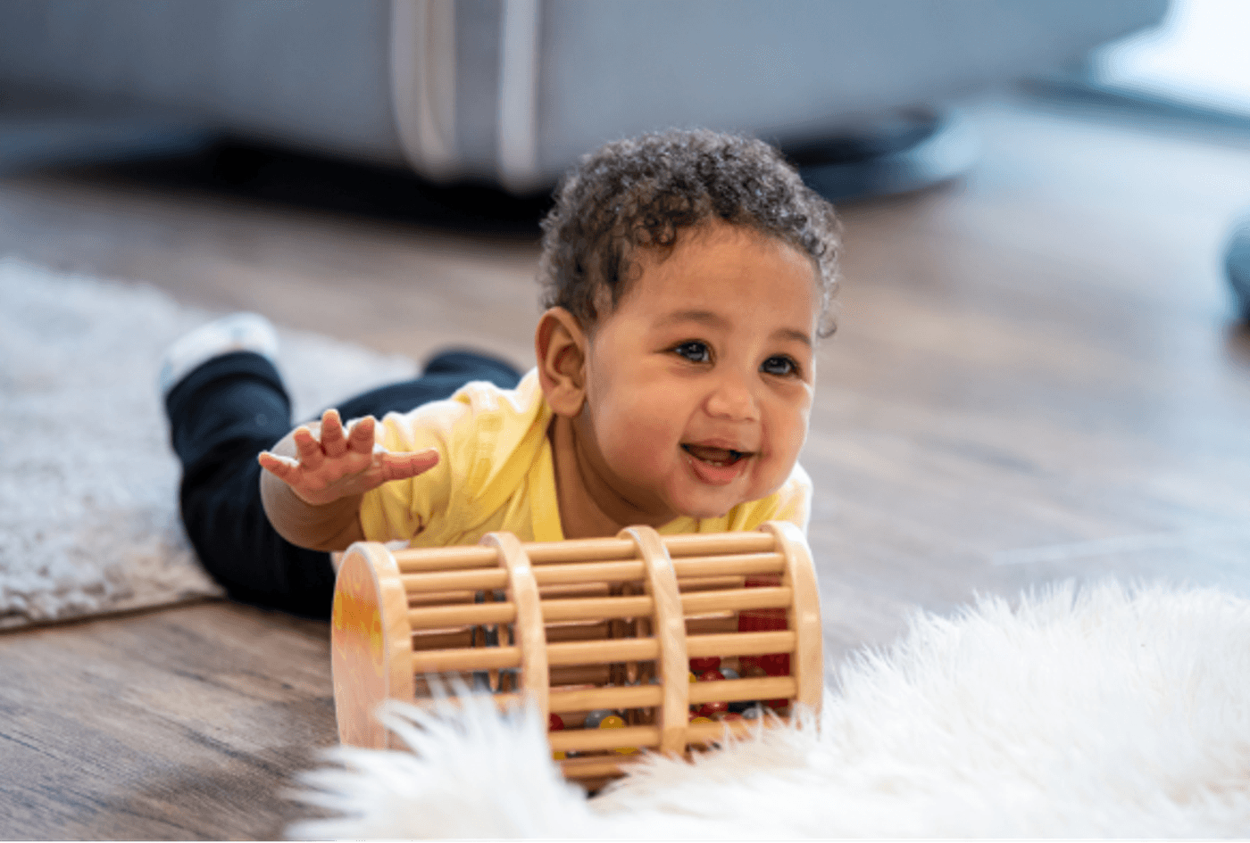 Child crawling with toy