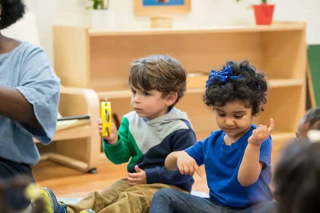parenting advice for preschoolers children engaged in group Montessori activity with learning materials